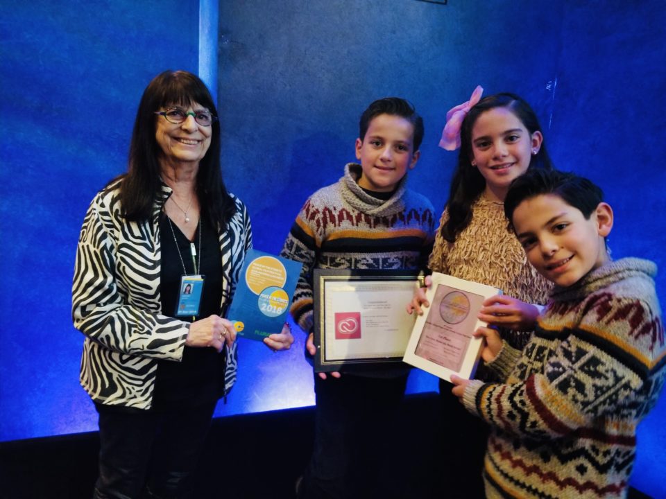 Peace in the Streets Global Film Festival winners from Mexico and Spain receiving Adobe Creative Cloud licenses at the U.N.